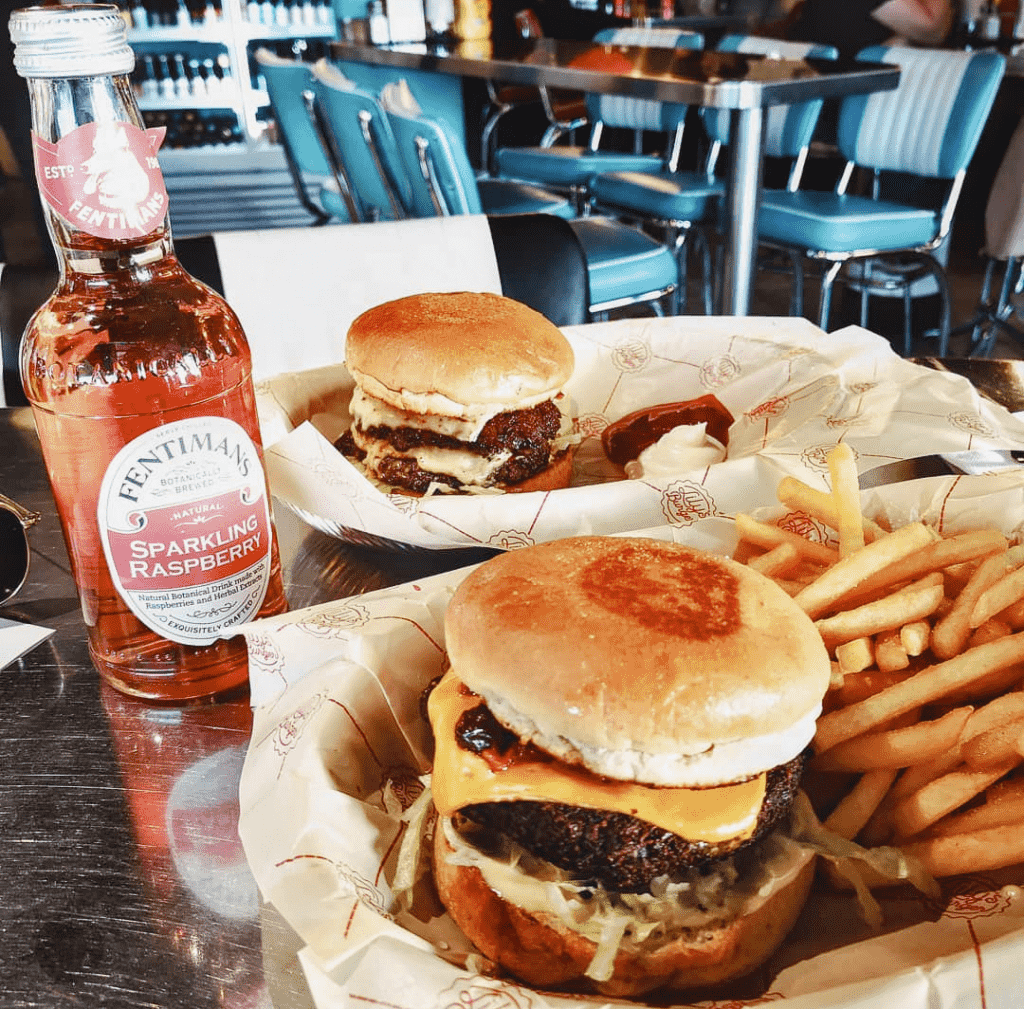 Burger with fries and drink in Lily's Burger restaurant